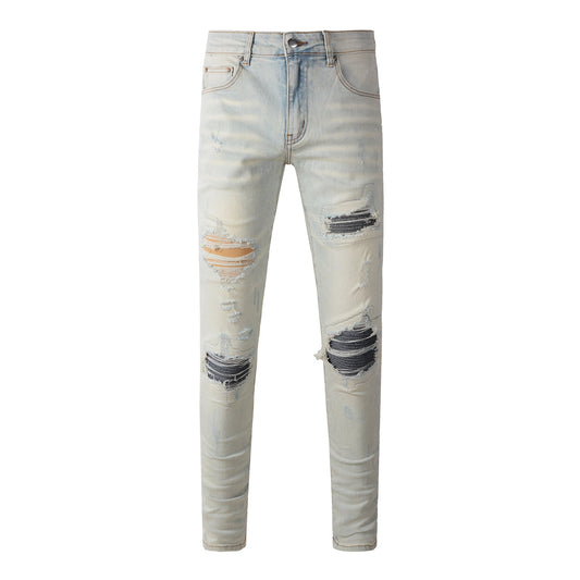 Men’s Light Washed Skinny Jeans with Heavy Ripped Details and Dark Contrast Patchwork for a Vintage Street Look 699